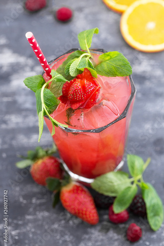 Red fresh summer drink with strawberry and mint top view with copy space