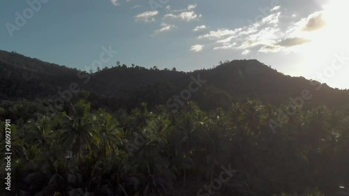 Flyover Philippines beach jungle by sunset