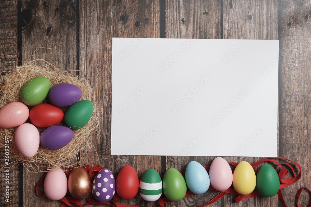 Flat-lay Easter eggs on wooden table.