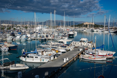 Antibes, France - Dec 2018: Boats in teh harbour against the castle