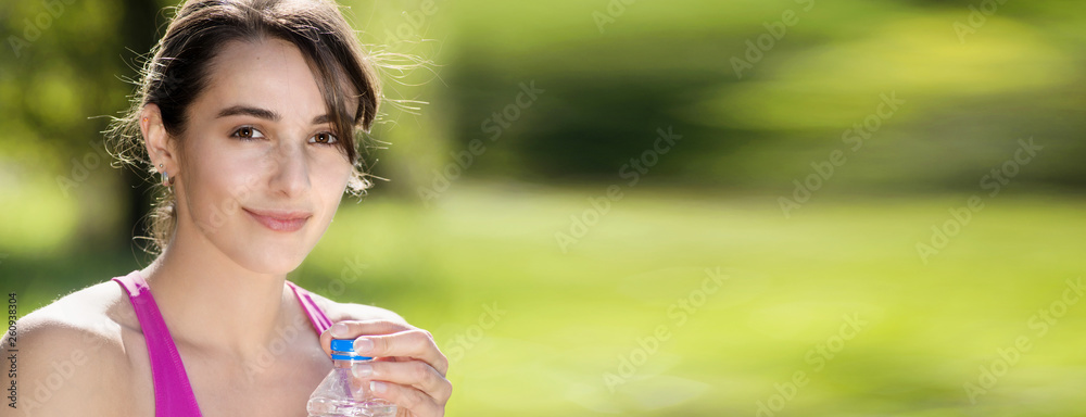 athletic girl drinking water after exercising athletic girl drinking water after exercising