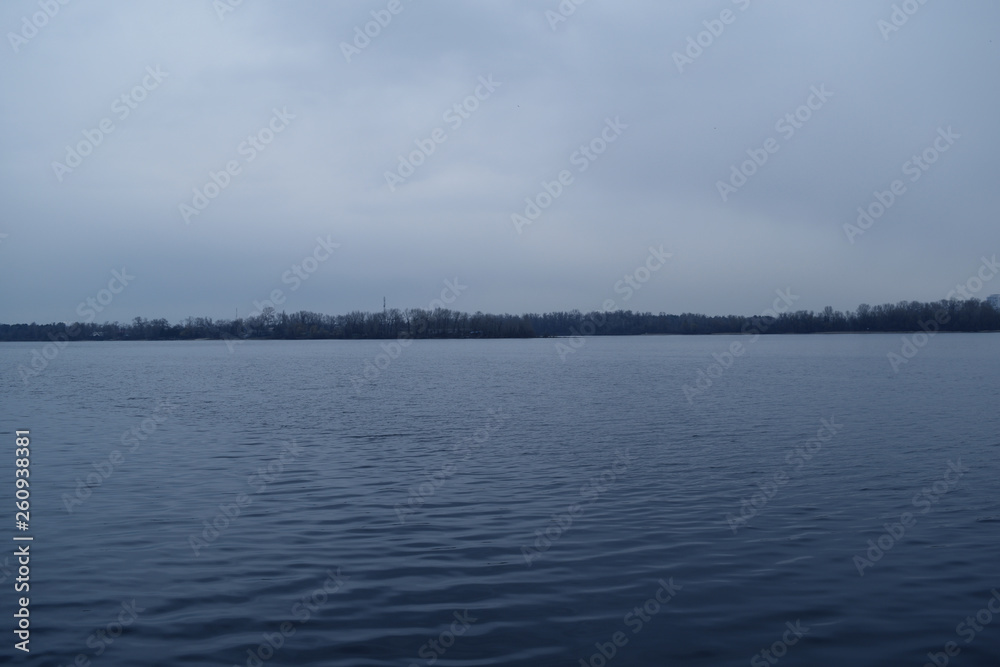 River, forest dark and overcast sky. Evening landscape. River, forest dark and overcast sky. Evening landscape.
