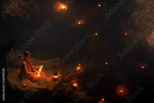 The meditation monk to follow the teachings of the Lord Buddha in the cave in Thailand. photo