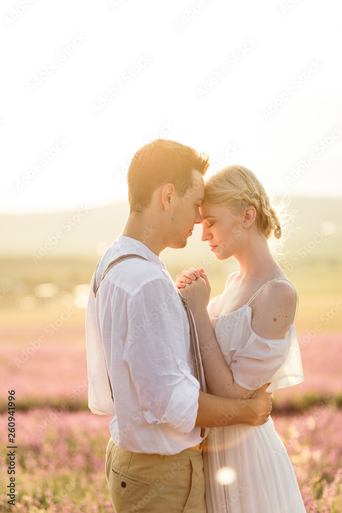 Beautiful portrait of man and women in lavender field