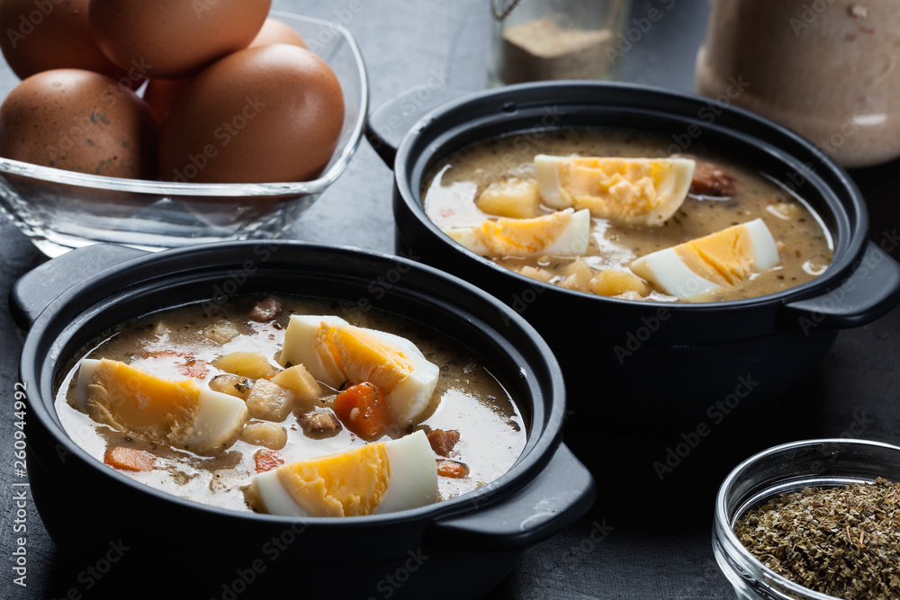 The sour soup made of rye flour with eggs The sour soup made of rye flour with eggs