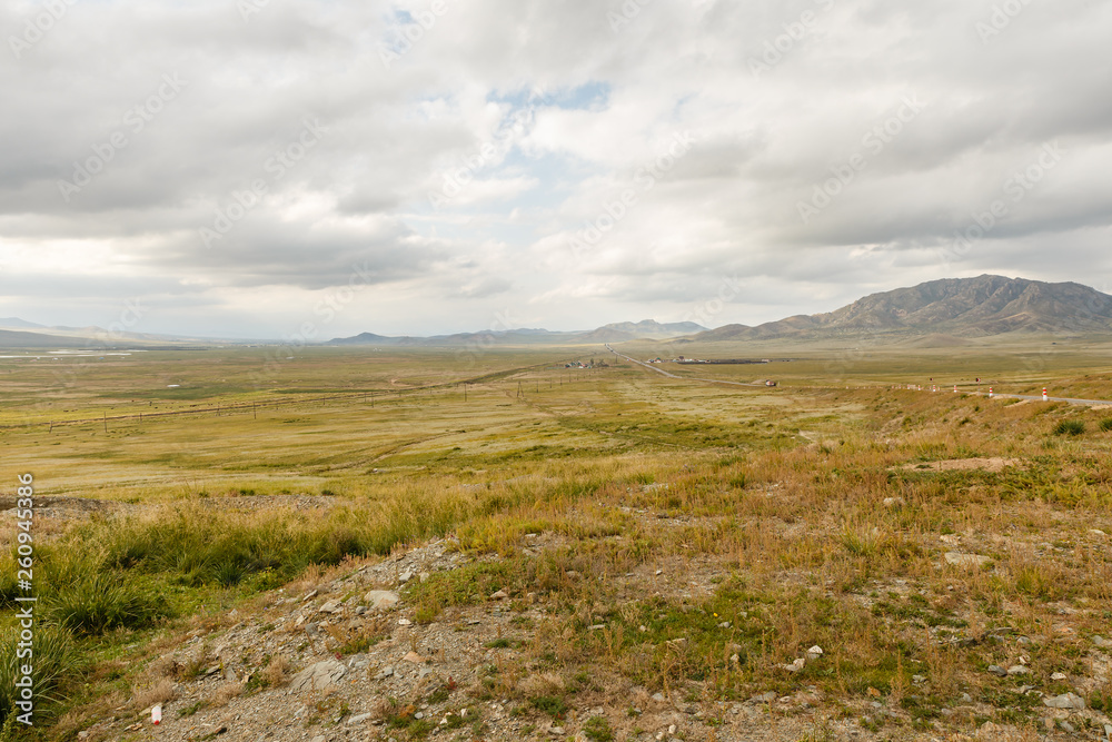 Mongolian Landscape of Orkhon Valley, Mongolian steppe with grassland, highway and railroad