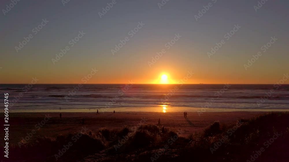 Slow motion, fixed position handheld shot of sunset over a very windy Ocean Beach, San Francisco, California. Slow motion, fixed position handheld shot of sunset over a very windy Ocean Beach, San Francisco, California.