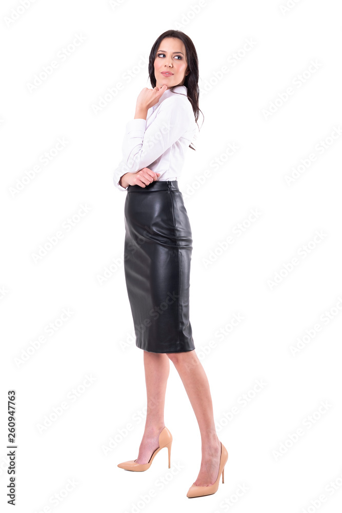 Beautiful elegant business woman in formal clothes looking back over shoulder. Full body isolated on white background. Beautiful elegant business woman in formal clothes looking back over shoulder. Full body isolated on white background.