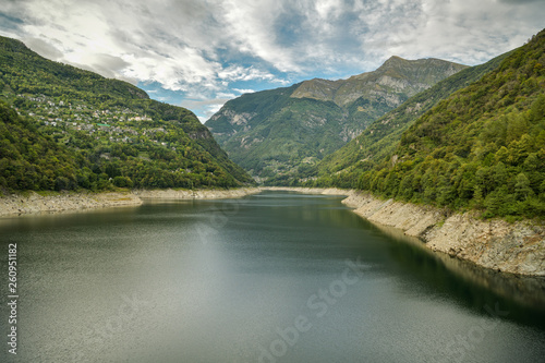 Lago di Vogorno with Swiss Alps in the background in canton of Ticino