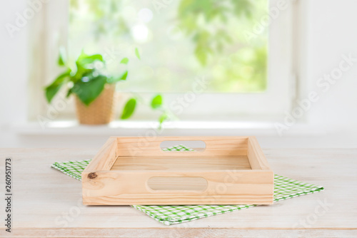 Fototapeta Naklejka Na Ścianę i Meble -  Empty wooden tray on table over blurred summer window background