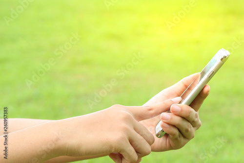 woman using smartphone in the park