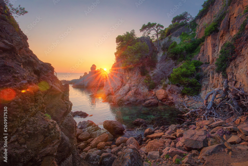 Morning landscape in sea bay of rocky coast. Scenery sea nature at sunrise. Amazing view on rocks and sea on spanish beach