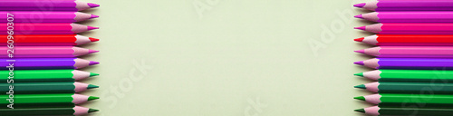 Bright and sharp colorful pencils on gray background. Banner for your advertising or web site.