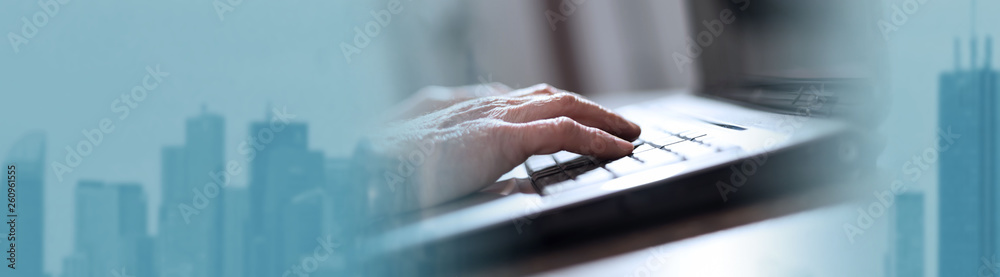 Hands using a laptop. panoramic banner Hands using a laptop. panoramic banner