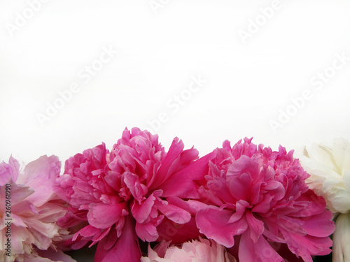 Mock up with pink and white flowers on a white table.    © Elena