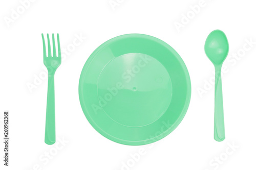 Top view Green plastic dish fork spoon isolated on white background