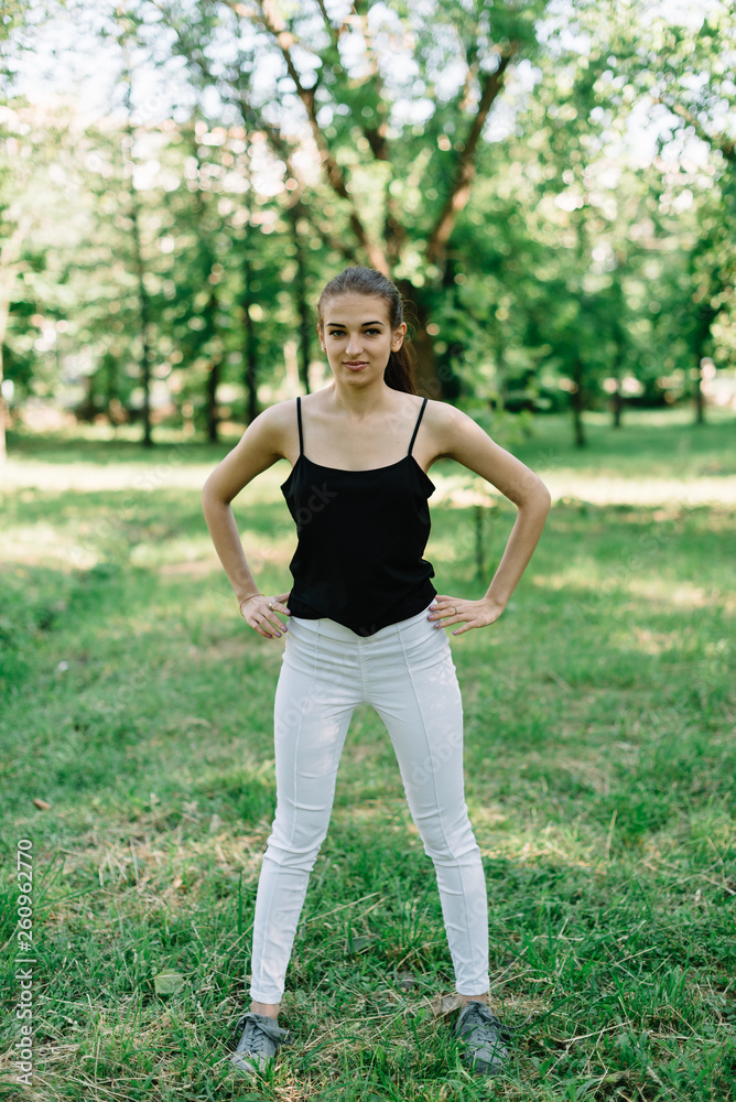 Young beautiful girl doing yoga outdoors in the park Young beautiful girl doing yoga outdoors in the park