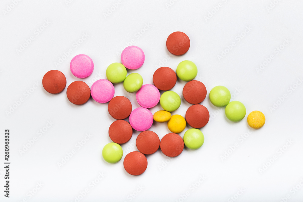 set of multi-colored tablets on a white background set of multi-colored tablets on a white background