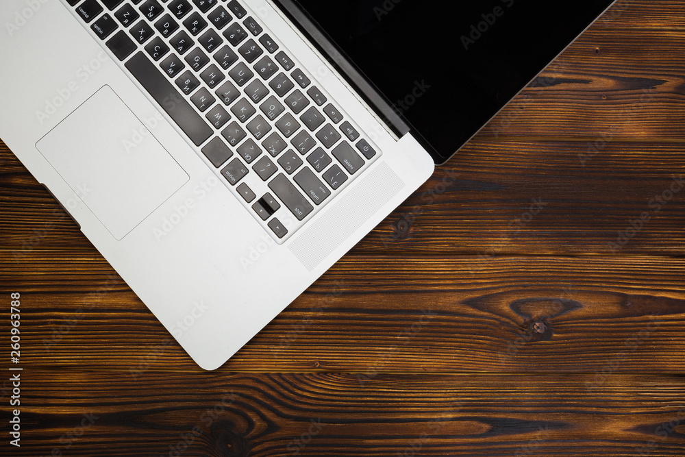 laptop on wooden background top view laptop on wooden background top view