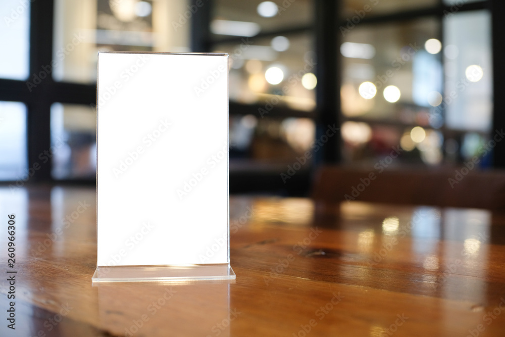 Menu frame space for text marketing promotion standing on wood table in Bar restaurant cafeใ Menu frame space for text marketing promotion standing on wood table in Bar restaurant cafeใ