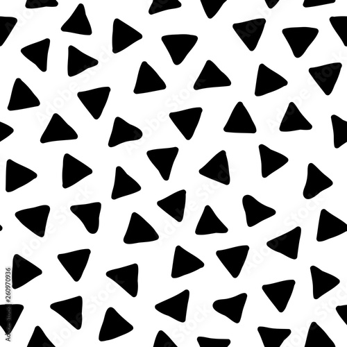 Hand drawn black and white vector doodle seamless pattern with scattered triangles, abstract geometric background in minimal style