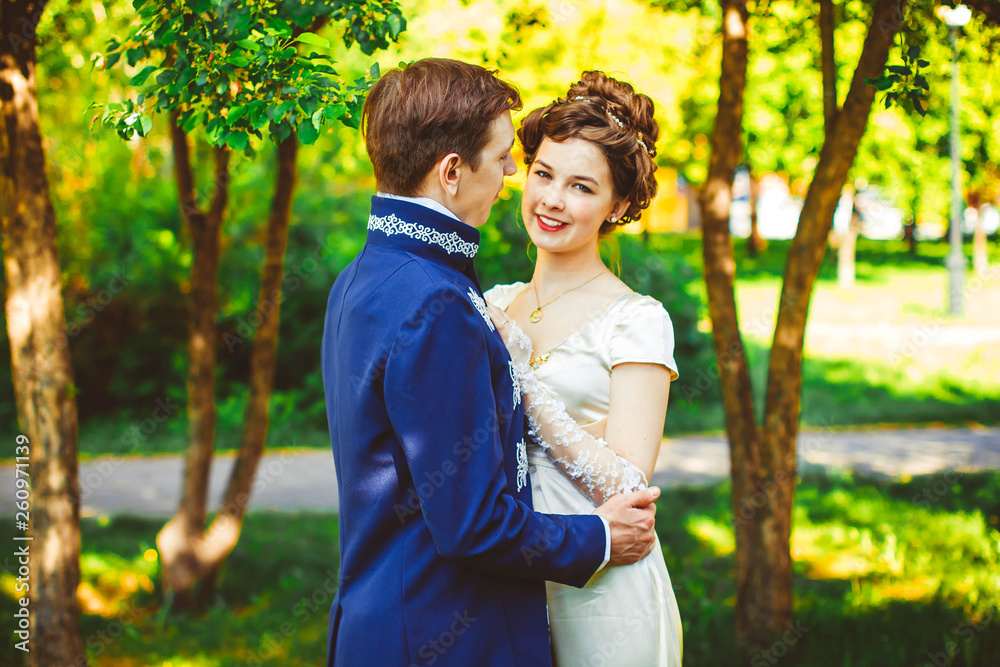 Beautiful couple in evening dress on the nature Beautiful couple in evening dress on the nature