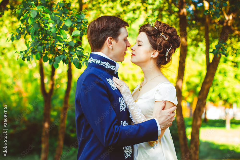 Beautiful couple in evening dress on the nature Beautiful couple in evening dress on the nature