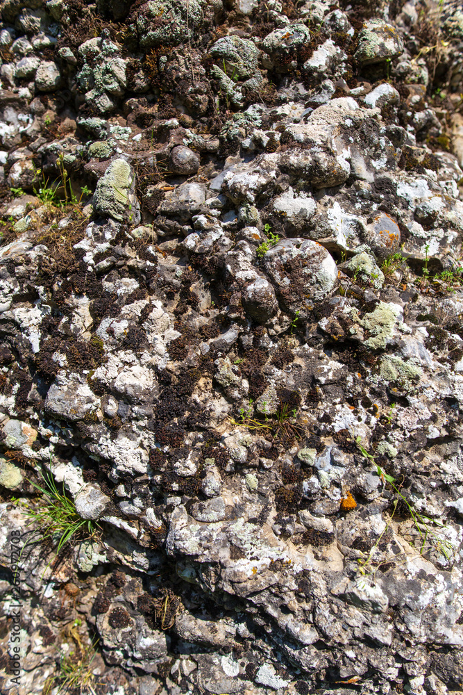 Stone rock in the mountains as a background