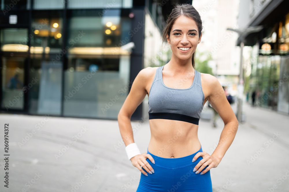 Picture of young attractive happy fitness woman