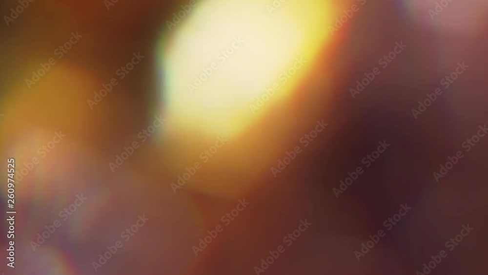 Psychodelic defocused background, modern mood, soft bokeh, iridescent light spots. Slow motion.