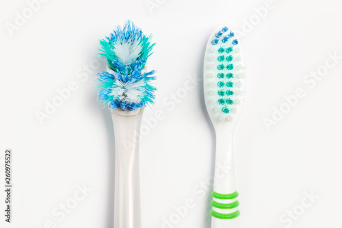 The old toothbrush and new toothbrush isolated on a white background.