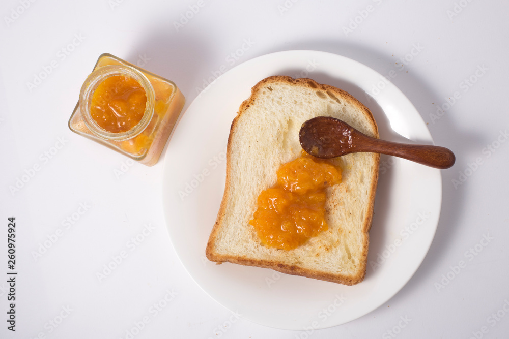 Slices of bread with orange jam Slices of bread with orange jam