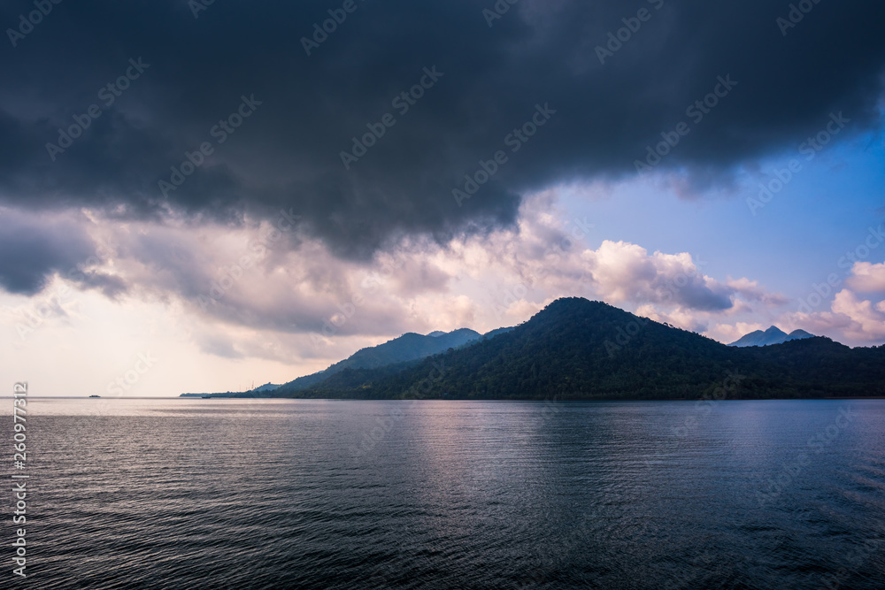 Sea and island with the rain cloud background