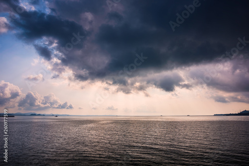 Sea with the rain cloud background in morning © songdech17