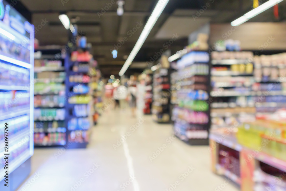 supermarket aisle with product shelves interior defocused blur background - obrazy, fototapety, plakaty 