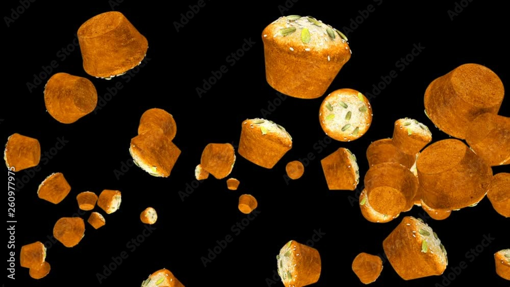 Muffins flying in slow motion against black Muffins flying in slow motion against black