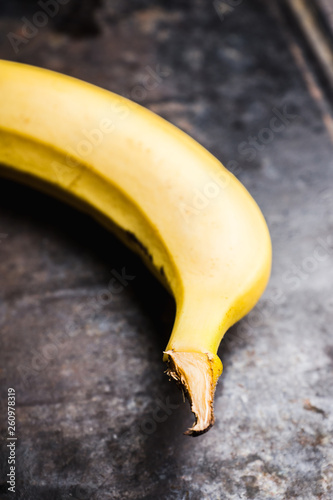 Close-up banana on the rustic background. Selective focus. Shallow depth of field.