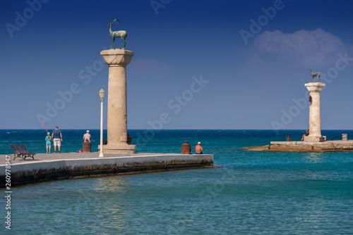 Rhodos, Greece - August 2016: Hirschkuh statue in the place of the Colossus of Rhodes at the entrance from inner embankment in the Mandraki old harbour of the City of Rhodes, in the Greek Dodecanese.