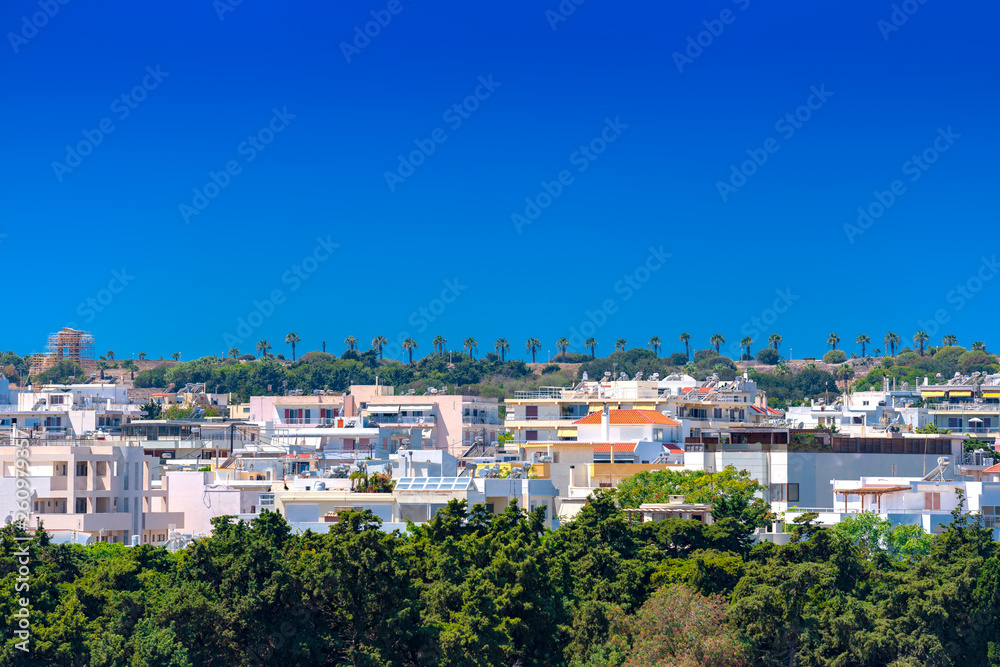 Fototapeta premium The new city of Rhodes developed high on the Monte Smith and near the Acropolis. From the Isiodou street, marked by tall palm trees, you have the most breathtaking view over the Rhodes island.
