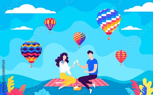 Happy couple have romantic date picnic and colour balloons in the sky