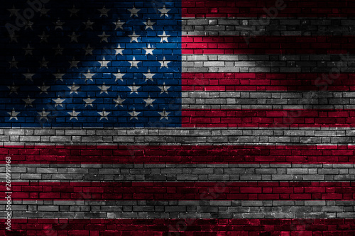 USA flag on brick wall at night