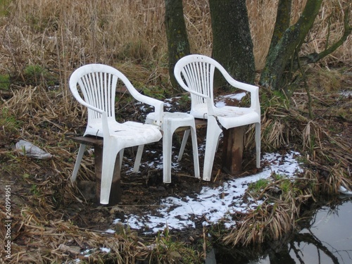 abandoned chairs in park