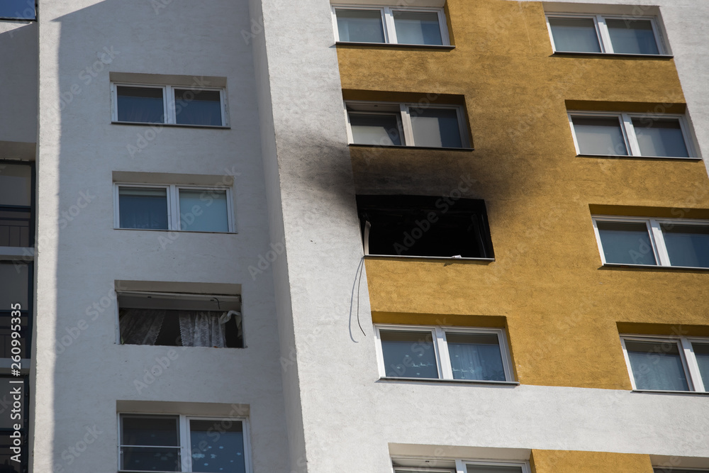 Front and windows of a condominium after an explosion and fire in its apartment. Front and windows of a condominium after an explosion and fire in its apartment.