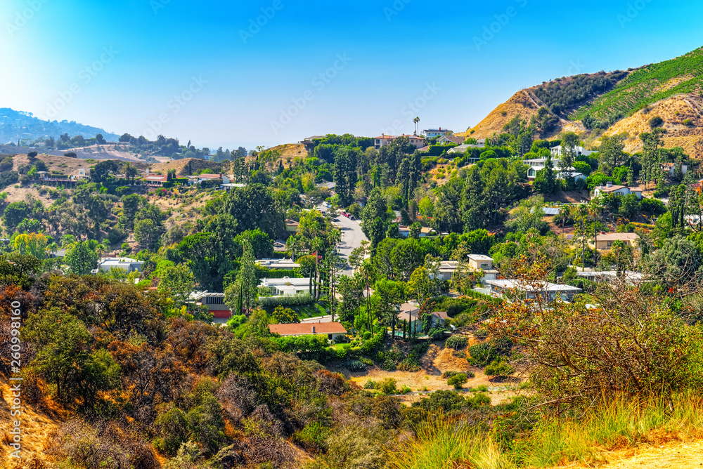 Urban views of the Beverly Hills area and residential buildings on the Hollywood hills.
