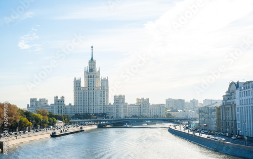 City landscape, view of the Moscow river with pleasure boats, Stalin skyscraper