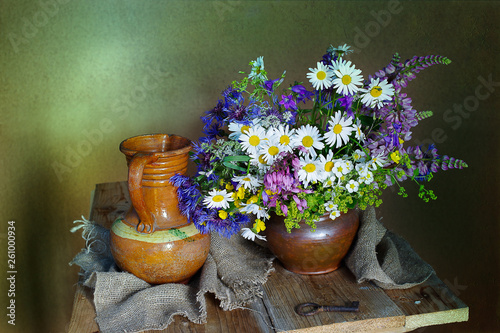 Still life with daisies in a clay vase on a brown background