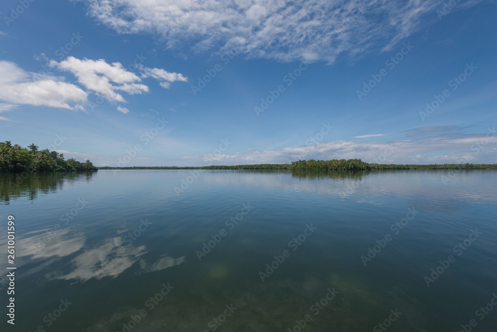 lake danao panorama photo with cloud reflection in water a blue colored island idyll 