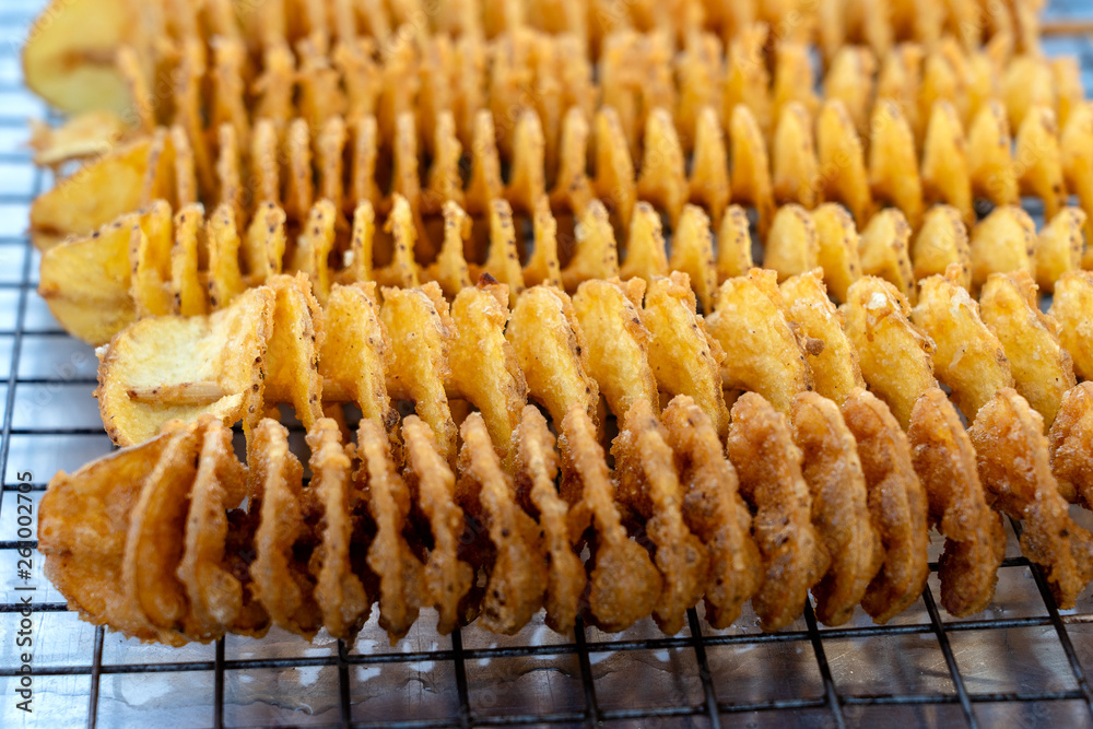 Unhealthy food, cooking potato chips, street food, a treat, frying fat, unhealthy food in Thailand market Unhealthy food, cooking potato chips, street food, a treat, frying fat, unhealthy food in Thailand market