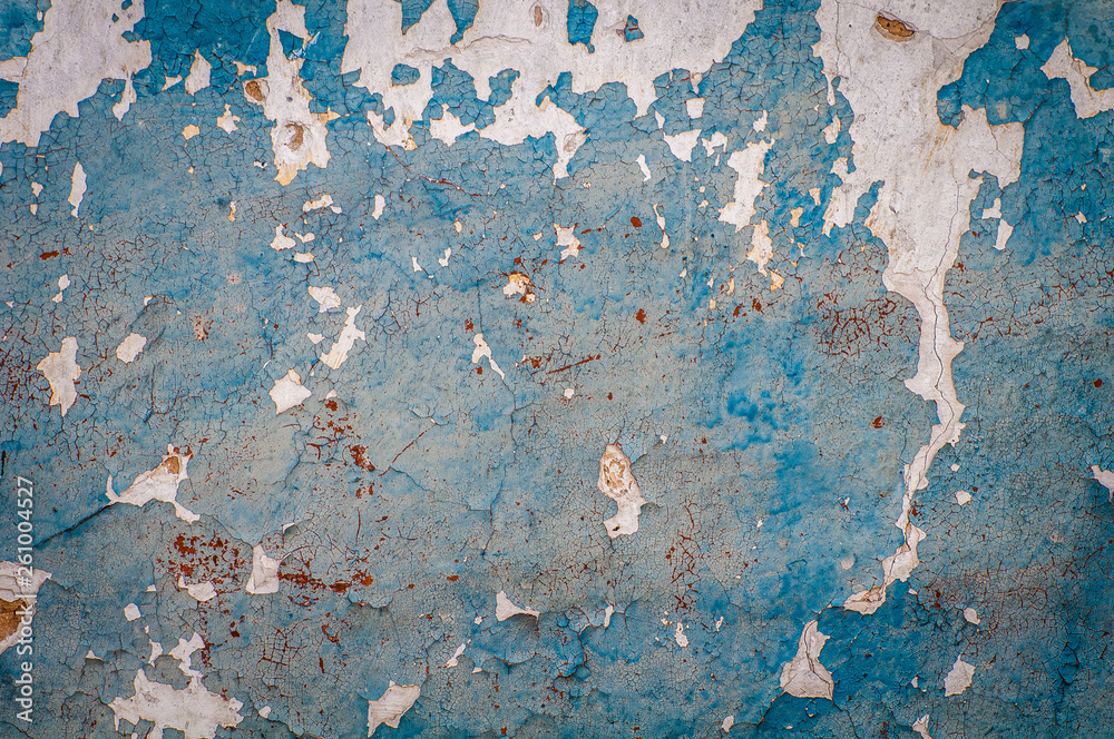 Old wall with dried, damaged very old paint. Texture, background.
