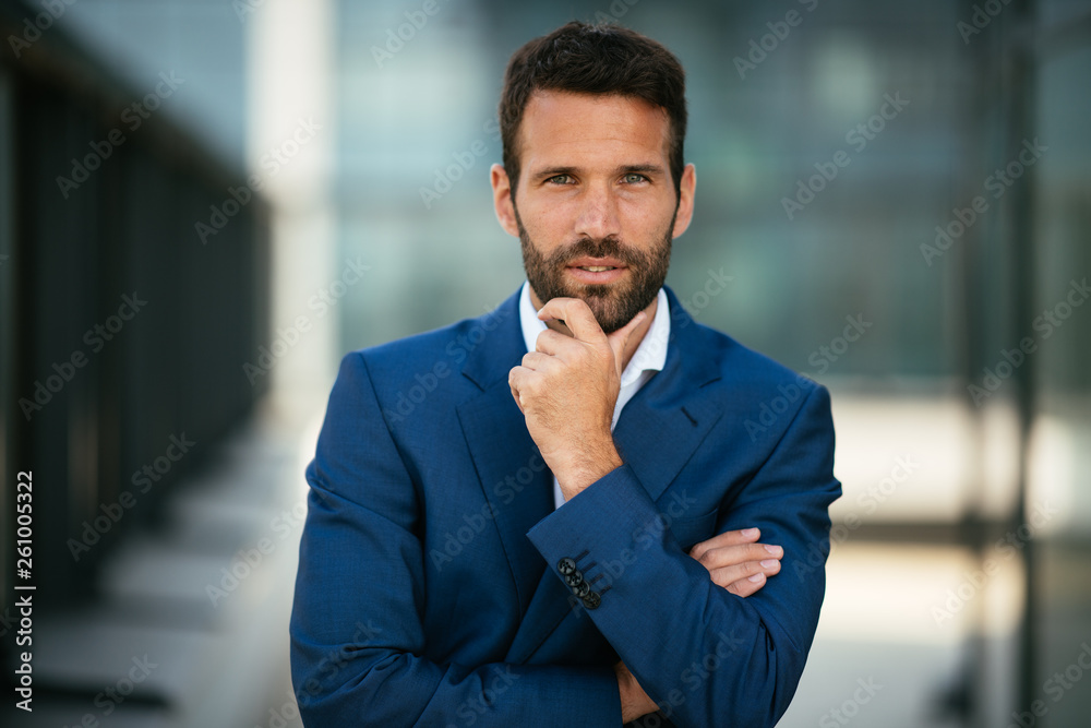 Businessman in a blue suit. Manager crossing hands. Executive manager thinking about his next plan. Lawyer in a blue suit.